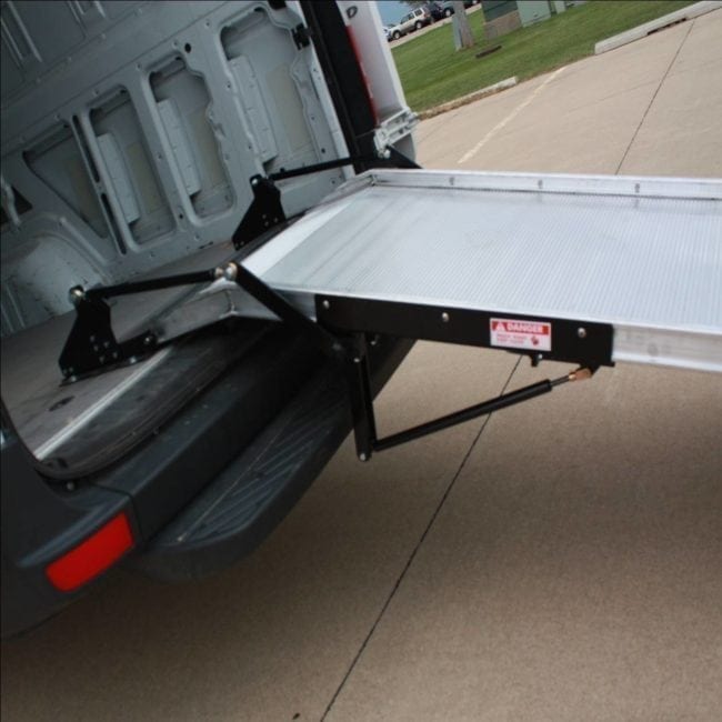 Link spring assist option shown installed on a work van ramp.