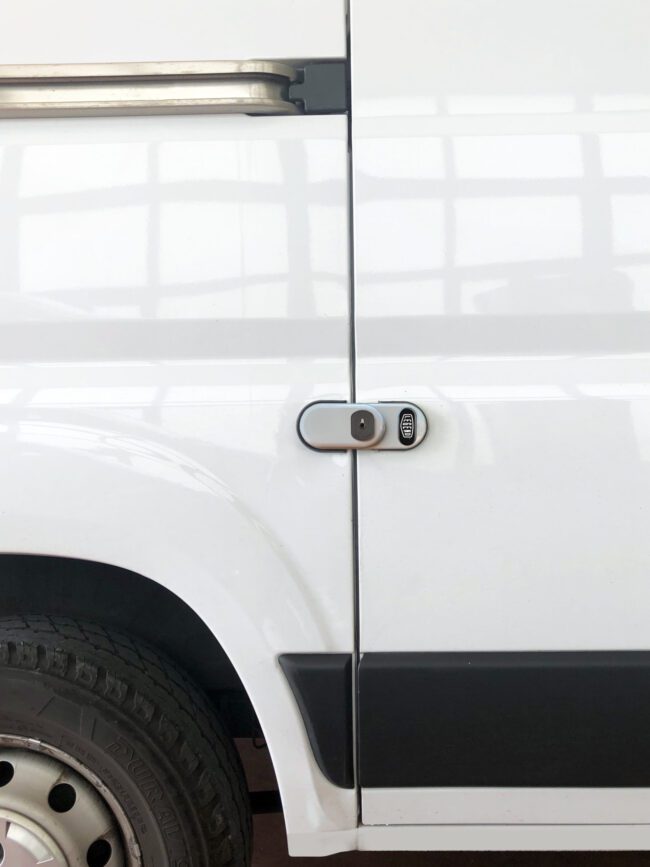 View of closed Legend SecuriLock installed on the side door of a white van.