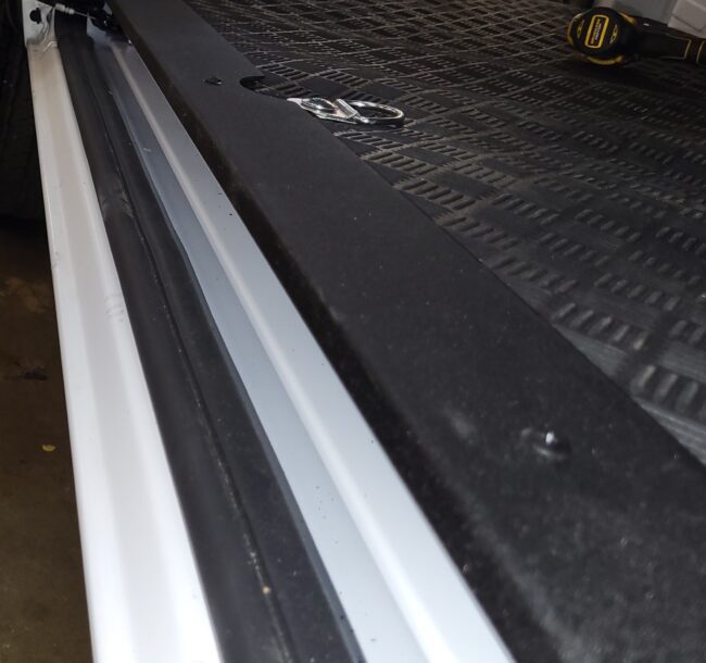 RAM ProMaster black textured sill installed in the van side entrance.
