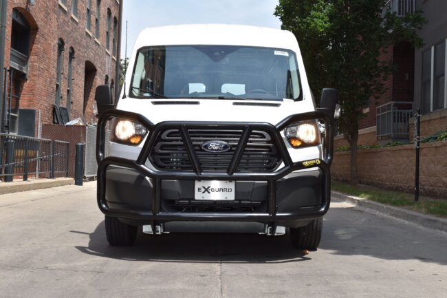 Front view of black Ex-Guard installed on a Ford Transit van.