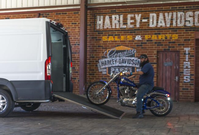 Check out our ramp installed on a Ford Transit shown fully open with man loading a motorcycle.