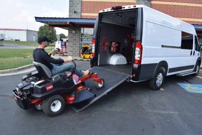 Check out our ramp installed on a RAM ProMaster. Shown fully open with a man driving a lawn mower into the van.